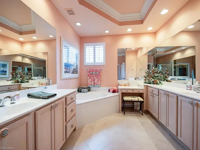 Living room with light tile patterned flooring, recessed lighting, a ceiling fan, and crown molding