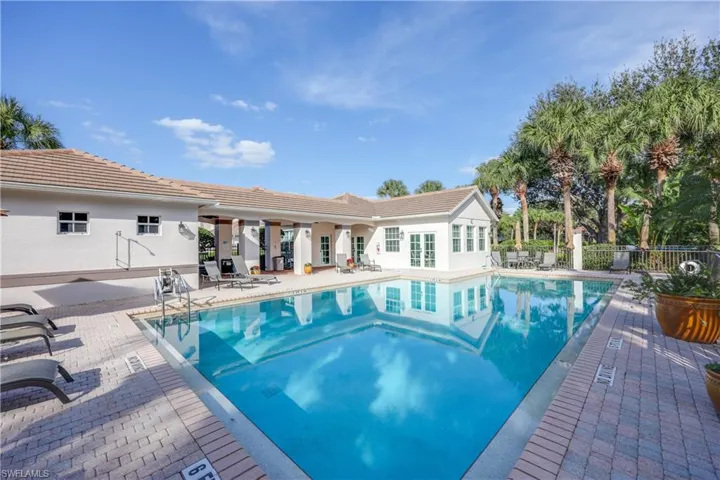 Community pool featuring a patio area