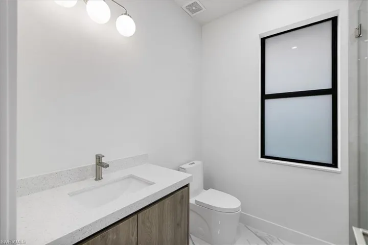Bathroom featuring toilet and vanity