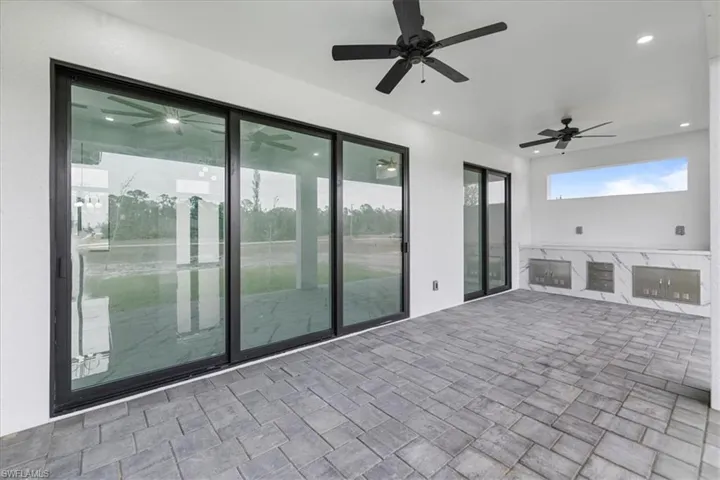 View of patio featuring ceiling fan