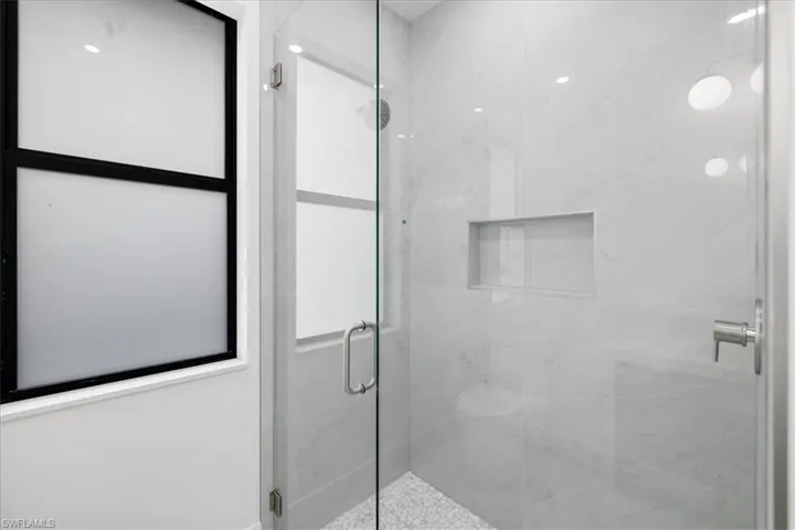 Bathroom featuring walk in shower