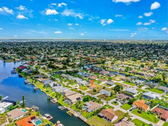 Canal-front property featuring a private boat dock and direct water access