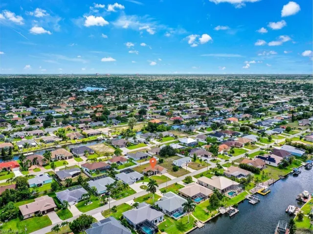 Expansive aerial perspective showcasing a residential neighborhood with numerous properties
