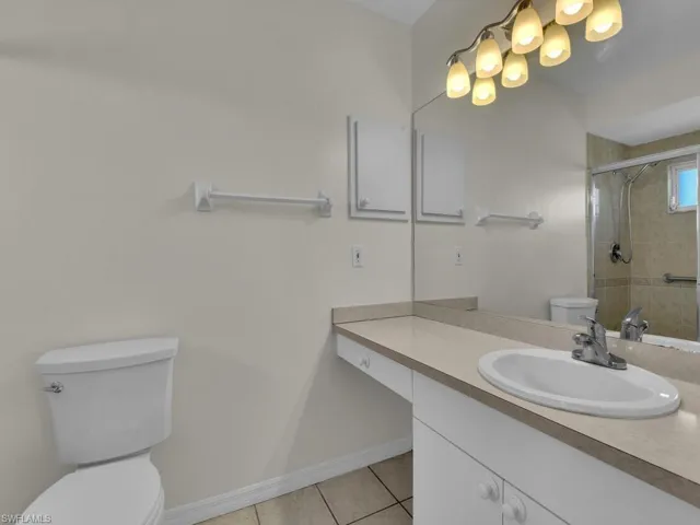 Functional bathroom vanity featuring an integrated sink, a single-handle faucet, and ample under-counter storage