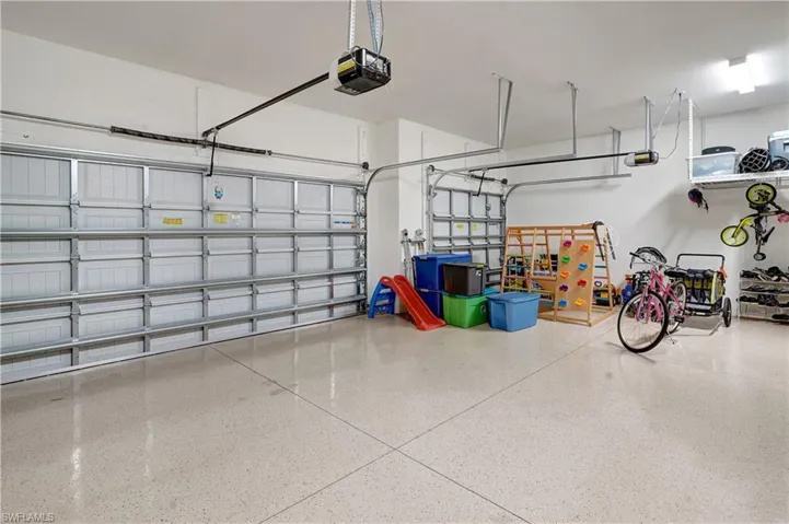 3-Car spacious garage with epoxy-coated floor, built-in heavy-duty hanging storage and, Wi-Fi-enabled remote garage door