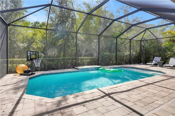 Spacious lanai with southern exposure, heated pool, backed up to a private preserve