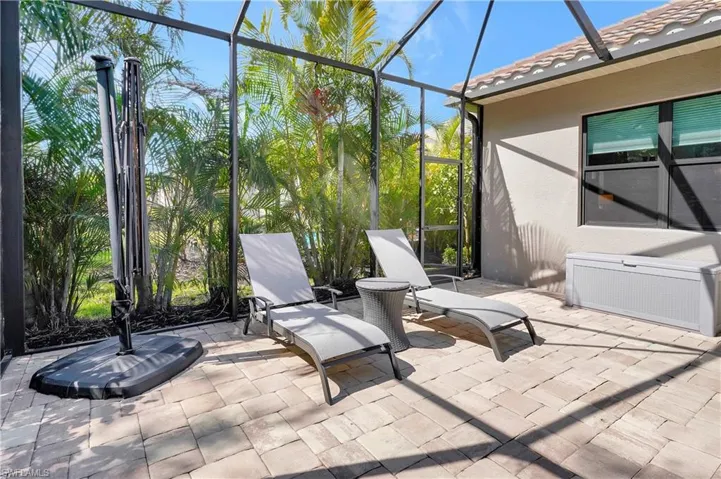 View of patio with a lanai