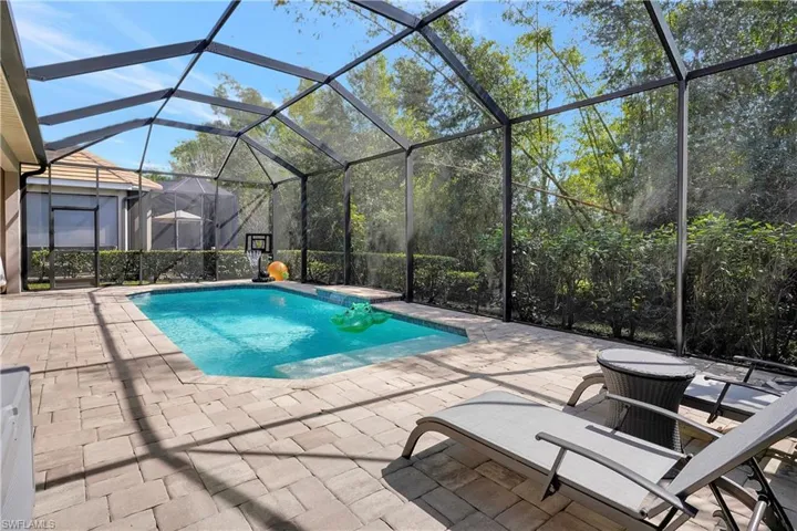 Spacious lanai with southern exposure, heated pool, backed up to a private preserve