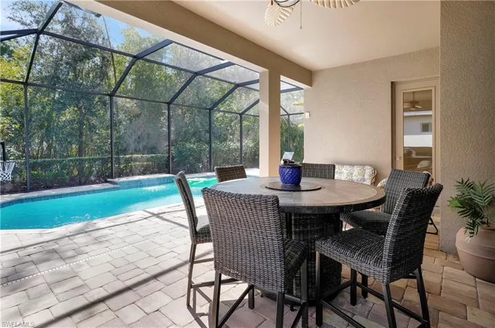 Spacious lanai with southern exposure, heated pool, backed up to a private preserve