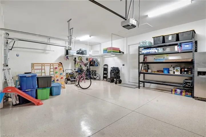 3-Car spacious garage with epoxy-coated floor, built-in heavy-duty hanging storage and, Wi-Fi-enabled remote garage door