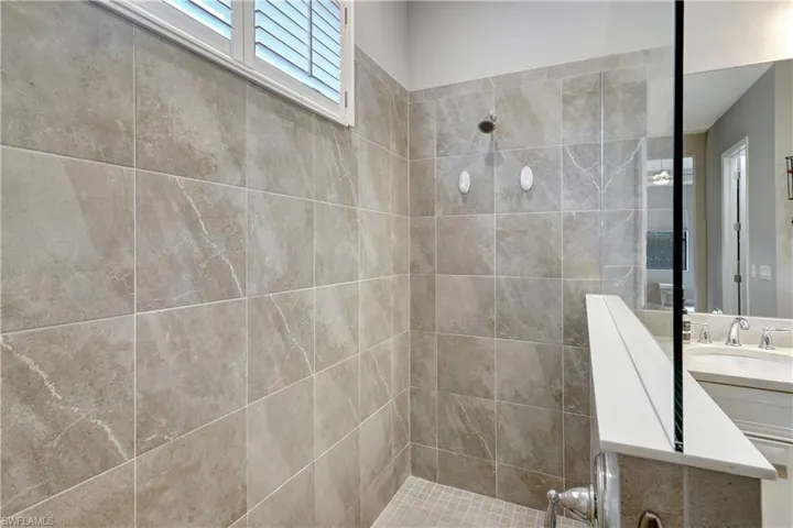 Bathroom with walk in shower and vanity