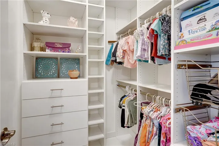 Third bedroom walk in closet with built-in shelving