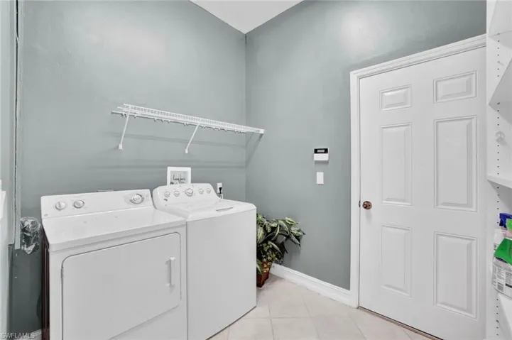 Painted accent wall in separate laundry room
