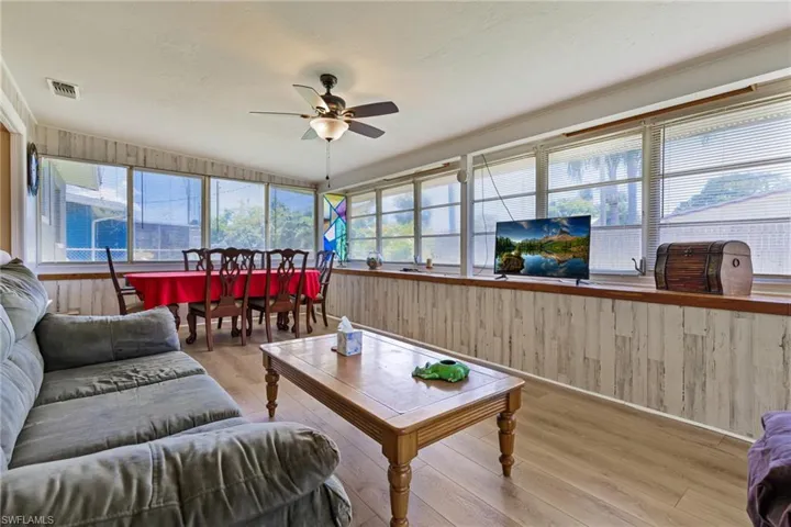 Sunroom featuring ceiling fan