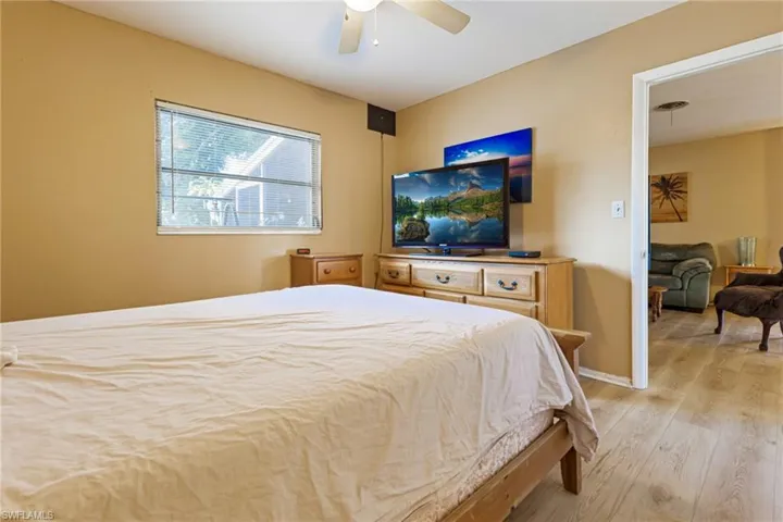 Bedroom featuring light wood-type flooring and ceiling fan
