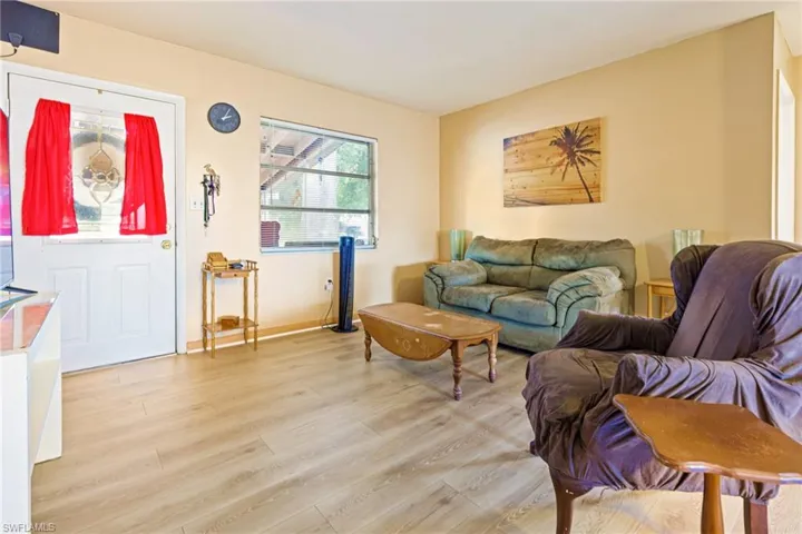 Living room with light hardwood / wood-style flooring