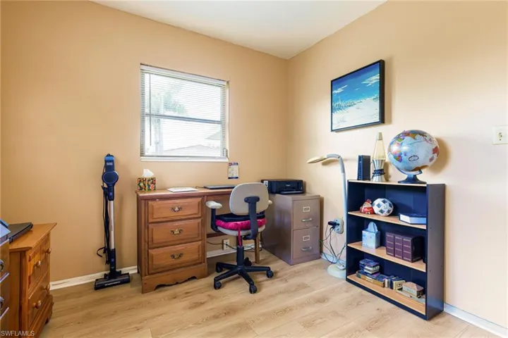 Office area with light hardwood / wood-style flooring