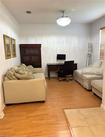 Wood-finish flooring throughout, complemented by a tiled entry