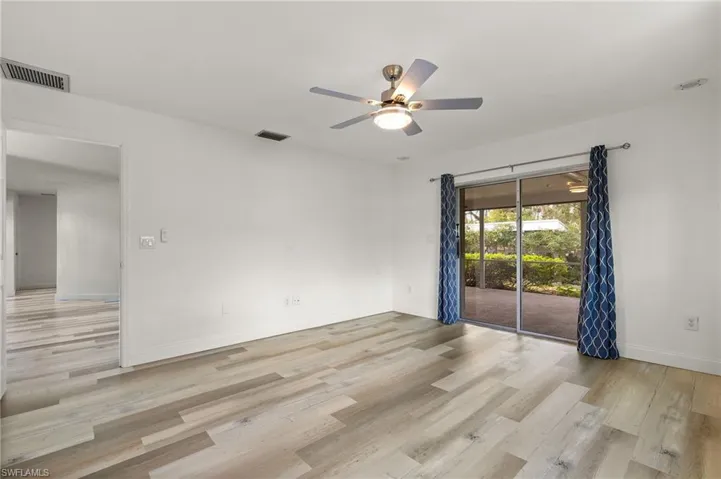 Spare room with light hardwood / wood-style floors and ceiling fan