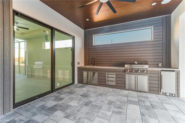 View of patio / terrace featuring exterior kitchen and ceiling fan
