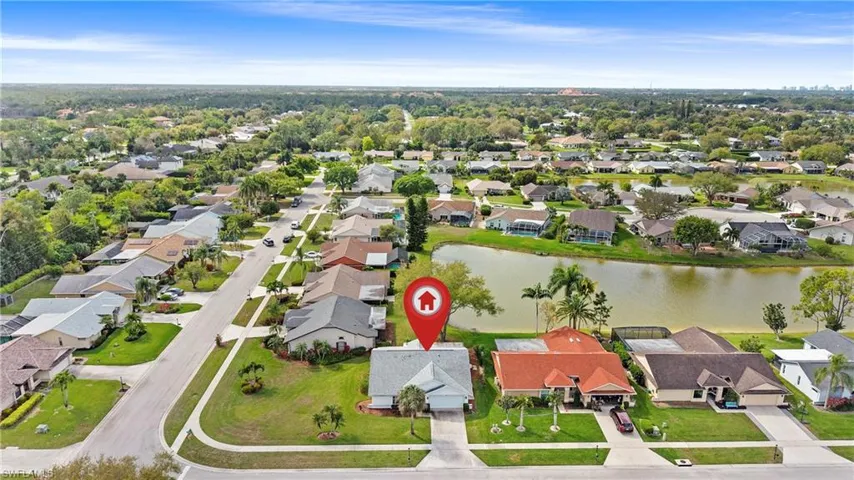 Aerial view of residential area with a nearby body of water