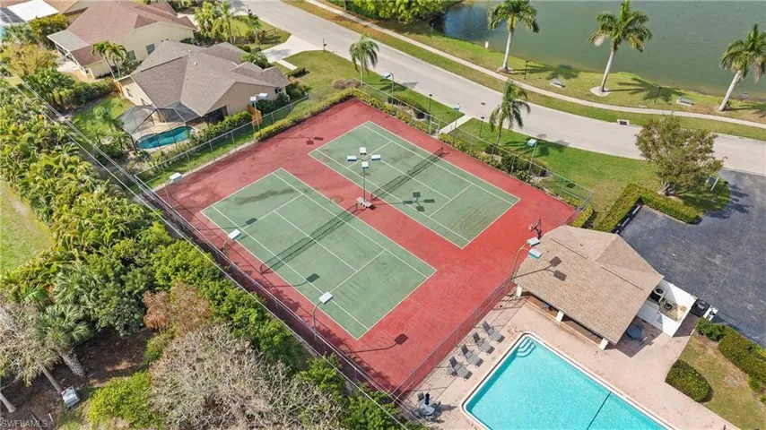 Drone / aerial view of a pool and a large body of water