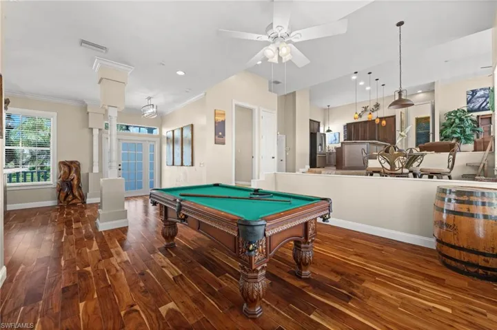 Recreation room featuring billiards table, dark wood-style flooring, crown molding, recessed lighting, and a ceiling fan