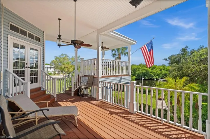 Deck featuring a ceiling fan and french doors