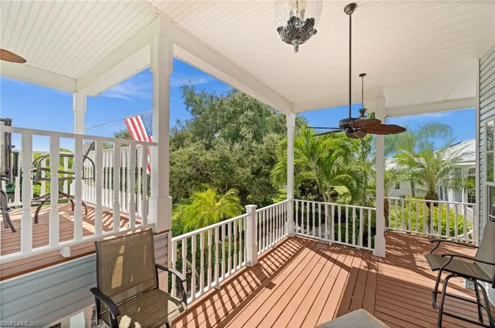 Wooden terrace featuring ceiling fan