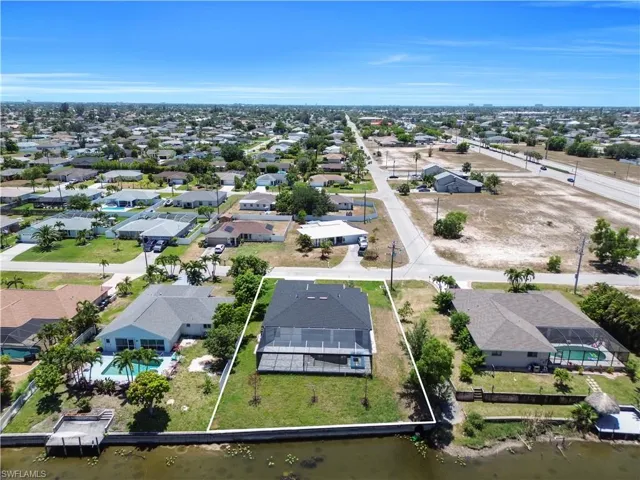 Aerial view with a residential view and a water view