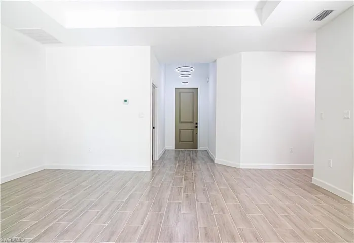 Empty room with light wood-type flooring
