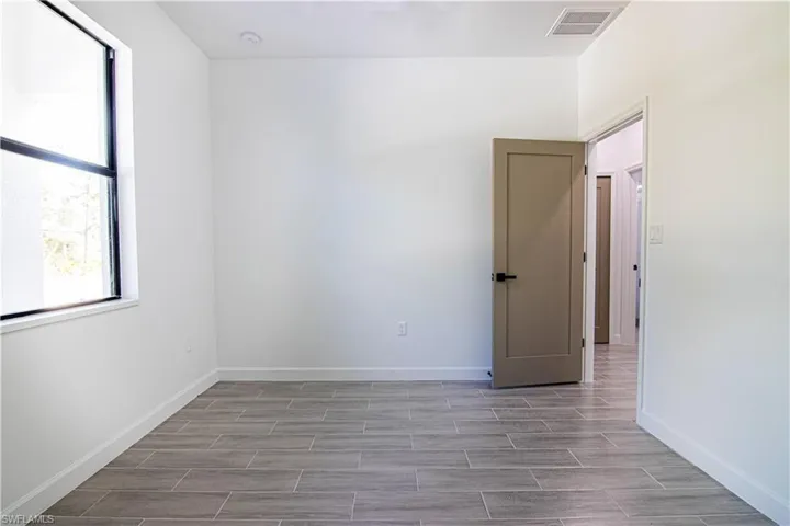 Empty room featuring light wood-type flooring