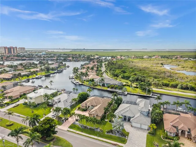 Aerial view of residential area with a large body of water