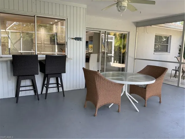 View of patio featuring a ceiling fan and outdoor dining space