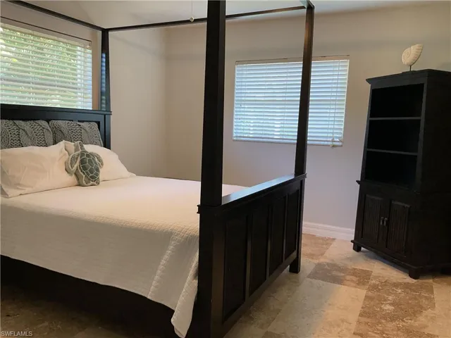 Bedroom featuring baseboards