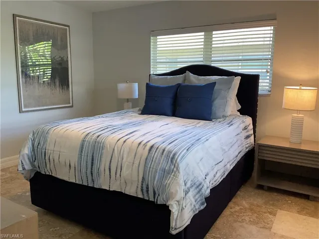 Bedroom with multiple windows
