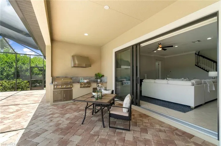 Outdoor covered space affords space for protected dining