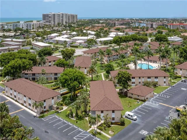 Aerial perspective showcasing multiple low-rise buildings with complementary brown tile roofs and light-colored facades