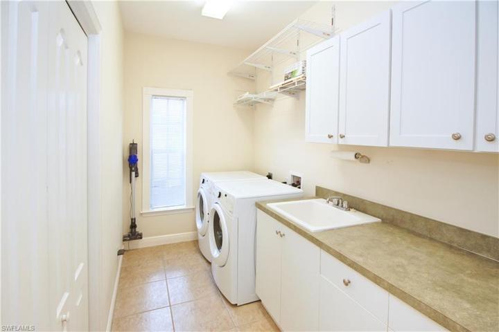 Laundry room with extra storage cabinets