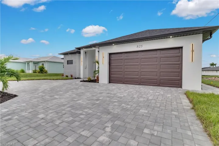 View of front of home featuring a garage