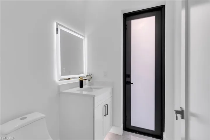 Bathroom featuring toilet and vanity