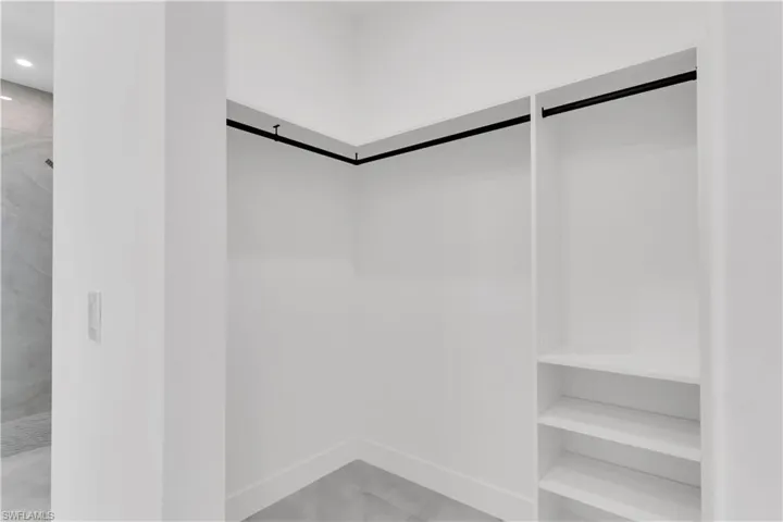 Walk in closet featuring a barn door