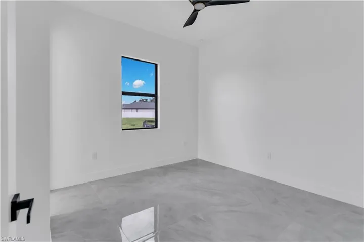 Spare room featuring ceiling fan