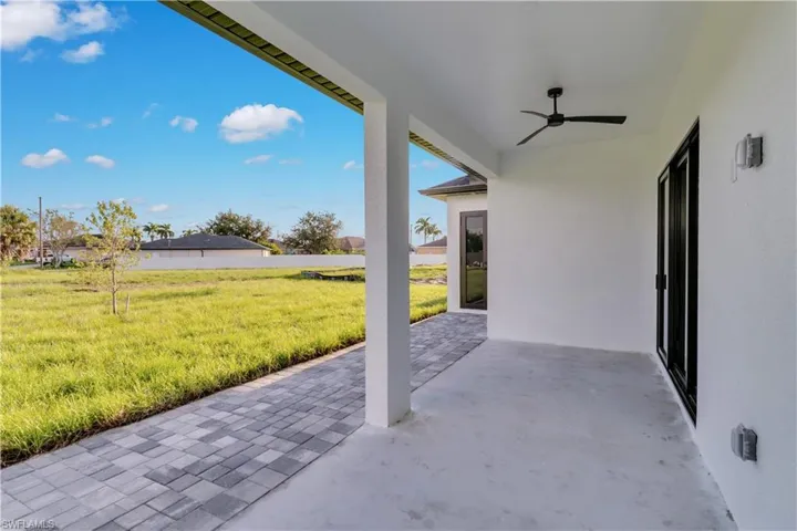 View of patio featuring ceiling fan