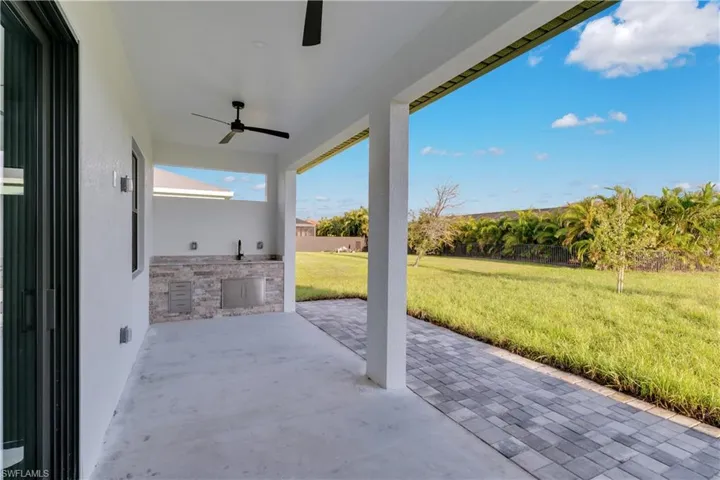 View of patio / terrace with exterior kitchen and ceiling fan