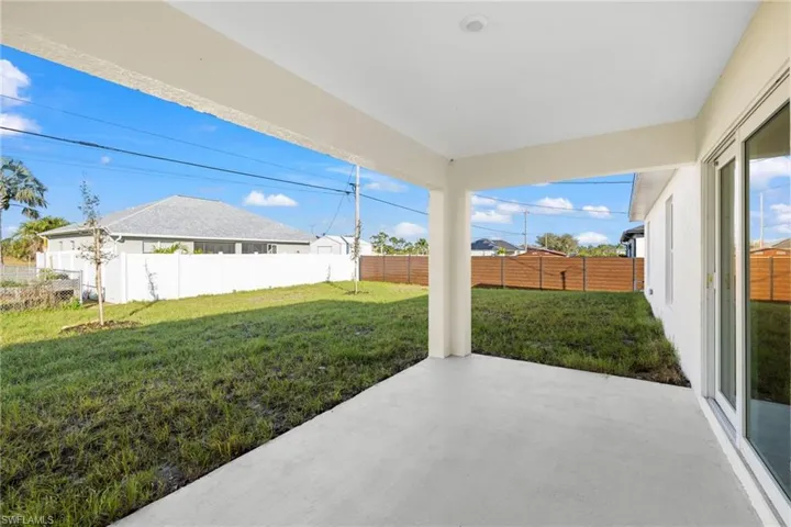Fenced backyard featuring a patio