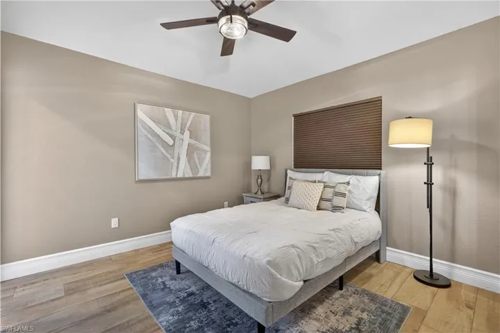 Bedroom featuring ceiling fan and light wood-style flooring