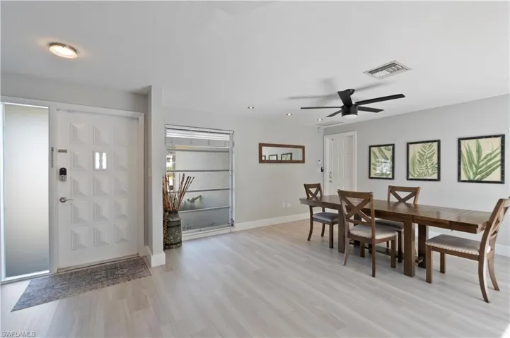 Dining space featuring light wood finished floors and a ceiling fan