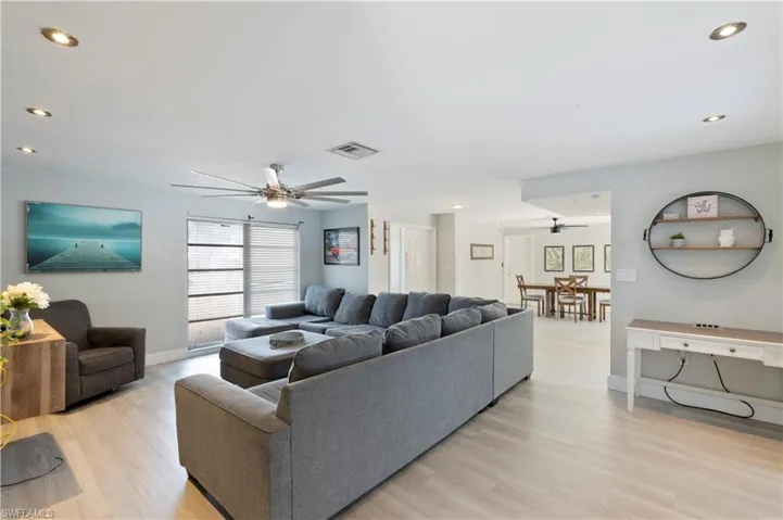 Living area featuring recessed lighting, ceiling fan, and light wood-style flooring
