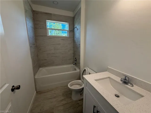 Bathroom featuring shower / bath combination and vanity